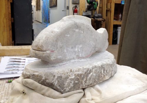 Amy's original plan was to do a pisces symbol with two fish, but the stone she got was closer to the shape of a single fish, and looking fishier every day.
