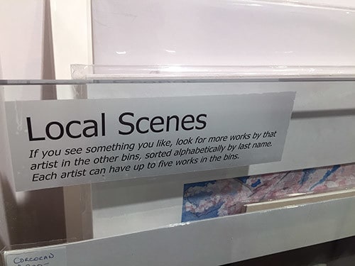The bins are arranged by artists' last names, and we also have special bins for local scenes and pieces under $100.