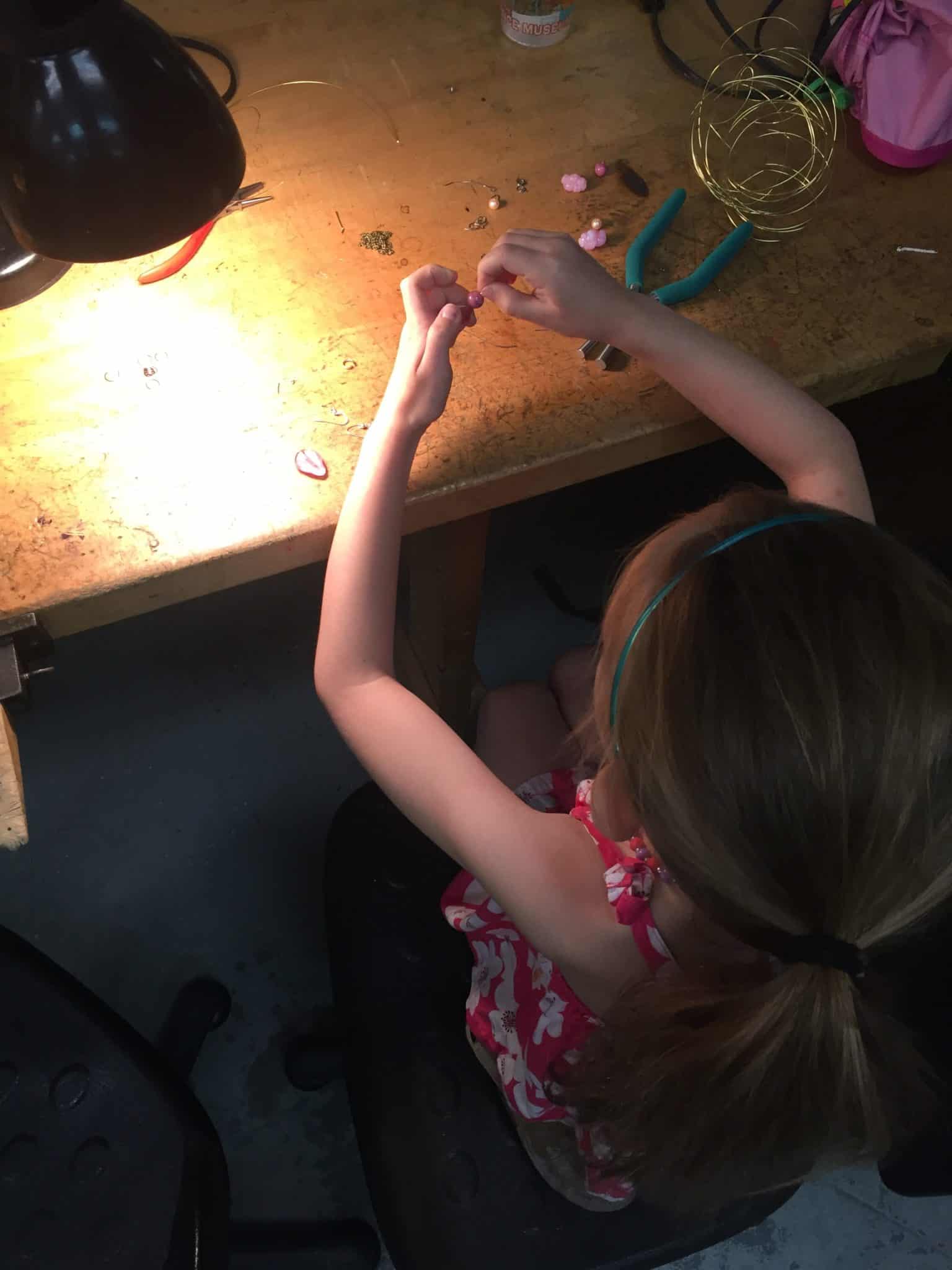 Jewelry campers working on earrings