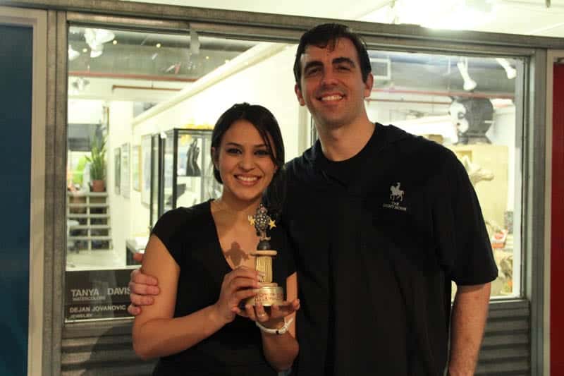 The winners! Above, the Light Horse Restaurant, and below, Trae from Chadwicks with "The Life Saver" photographer Claire Carroll. Torpedo Factory artist Lisa Schumaier made the trophies.