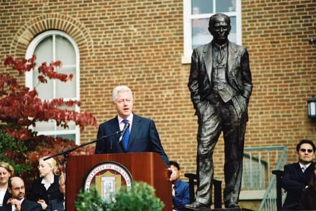 Bill Clinton speaks at the dedication of Gretta Bader's Fulbright statue in 2002.  (Photo by Russell Cothren, University of Arkansas. Used with permission.)