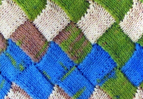 A knit throw by Diana Kreutz.