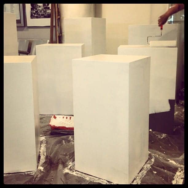 Preparing the sculpture pedestals for the annual exhibit.