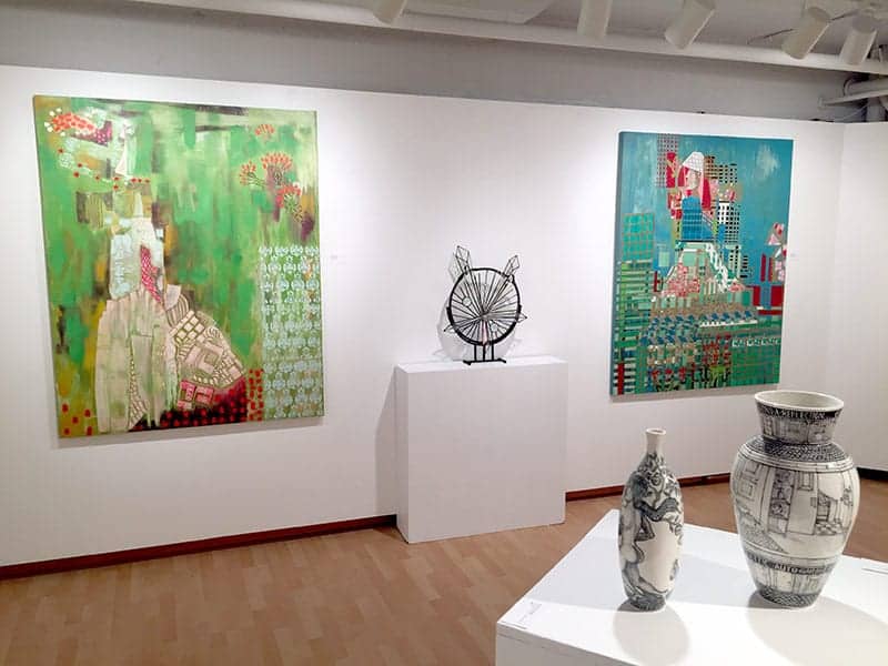 Three of the newly juried artists on view in Target Gallery: Naomi Christianson (paintings), Stephen Sherwin (stained glass), and Marcel Artes Deolozo (ceramics)